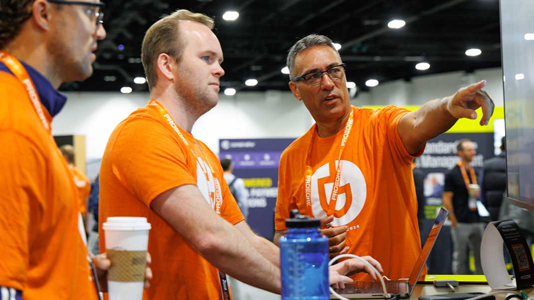 Three men wearing Groundbreak t shirts at the event