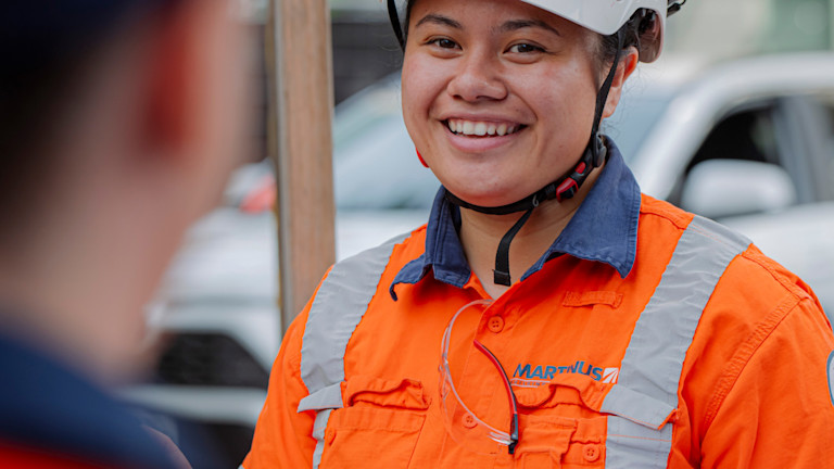 A Martinus contractor smiling to another contractor