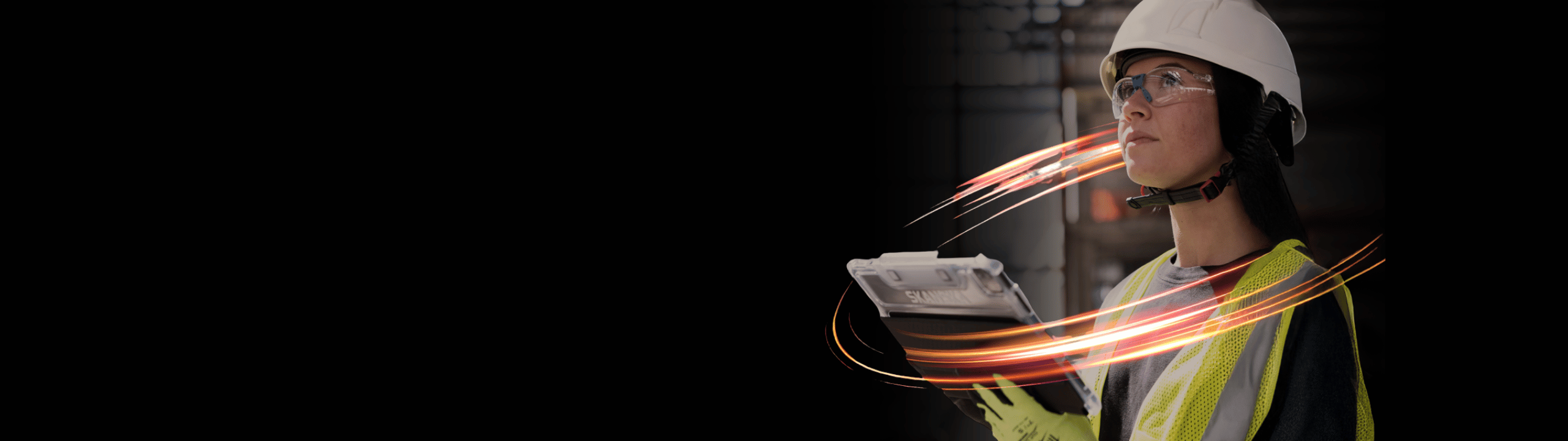 Construction worker reviewing plans on site